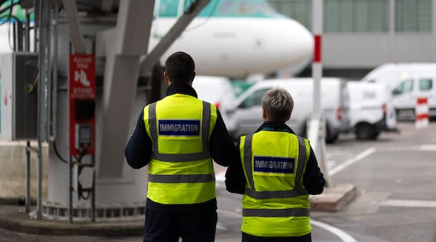 Checking passports with immigration control at Dublin Airport