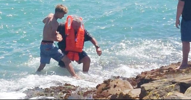 Surf coach, NSRI the heroes of dramatic river mouth rescue