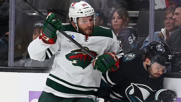 >-nhl-reduces-ryan-hartman-ban-to-8-games-for-slamming stutzle​​​​​​​’s-head-to-ice